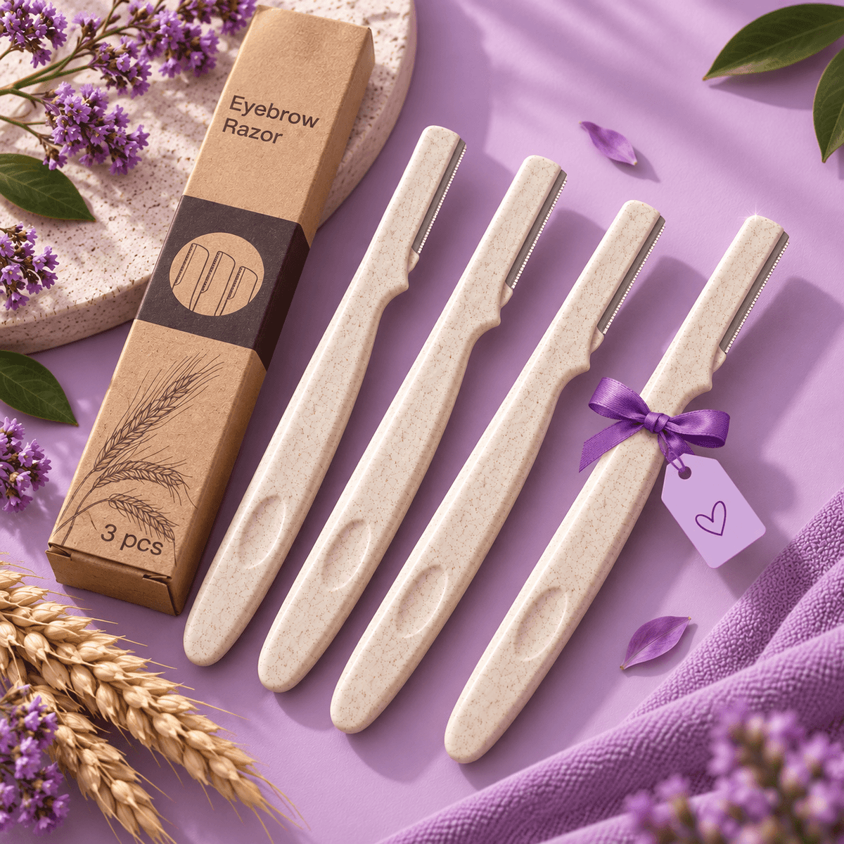 Four bamboo eyebrow razors arranged diagonally next to their kraft paper packaging box on a lavender background, styled with purple flowers, green leaves, and wheat stalks.